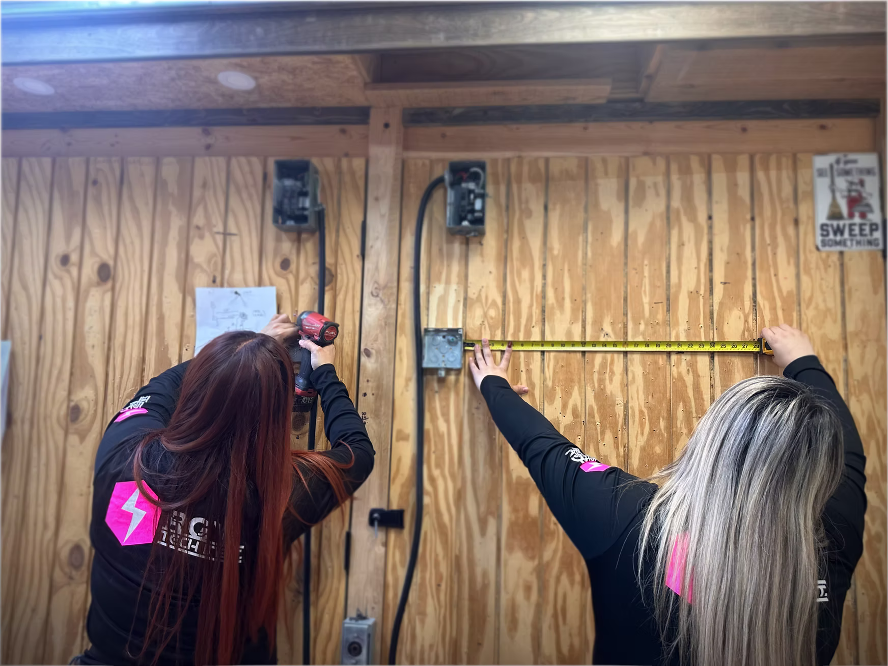 Students measuring a wiring layout